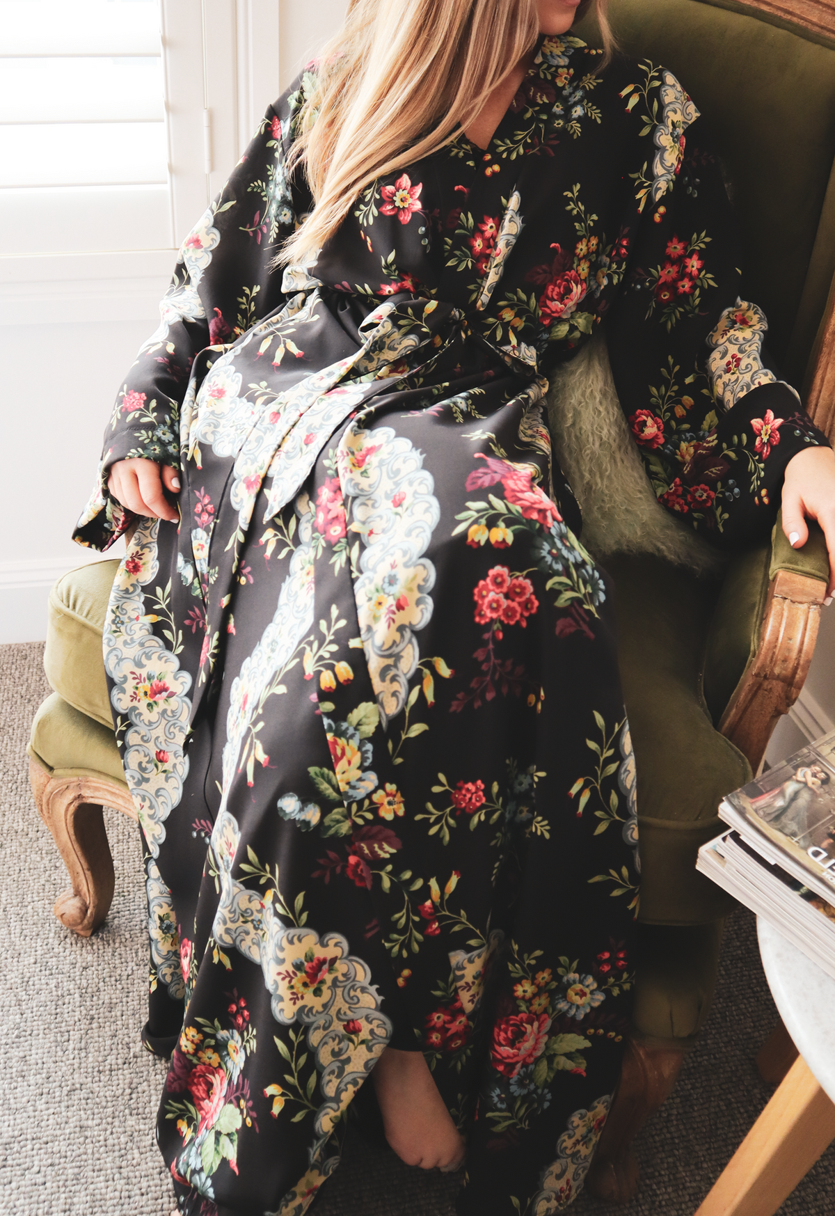 Seated view of silk couture robe